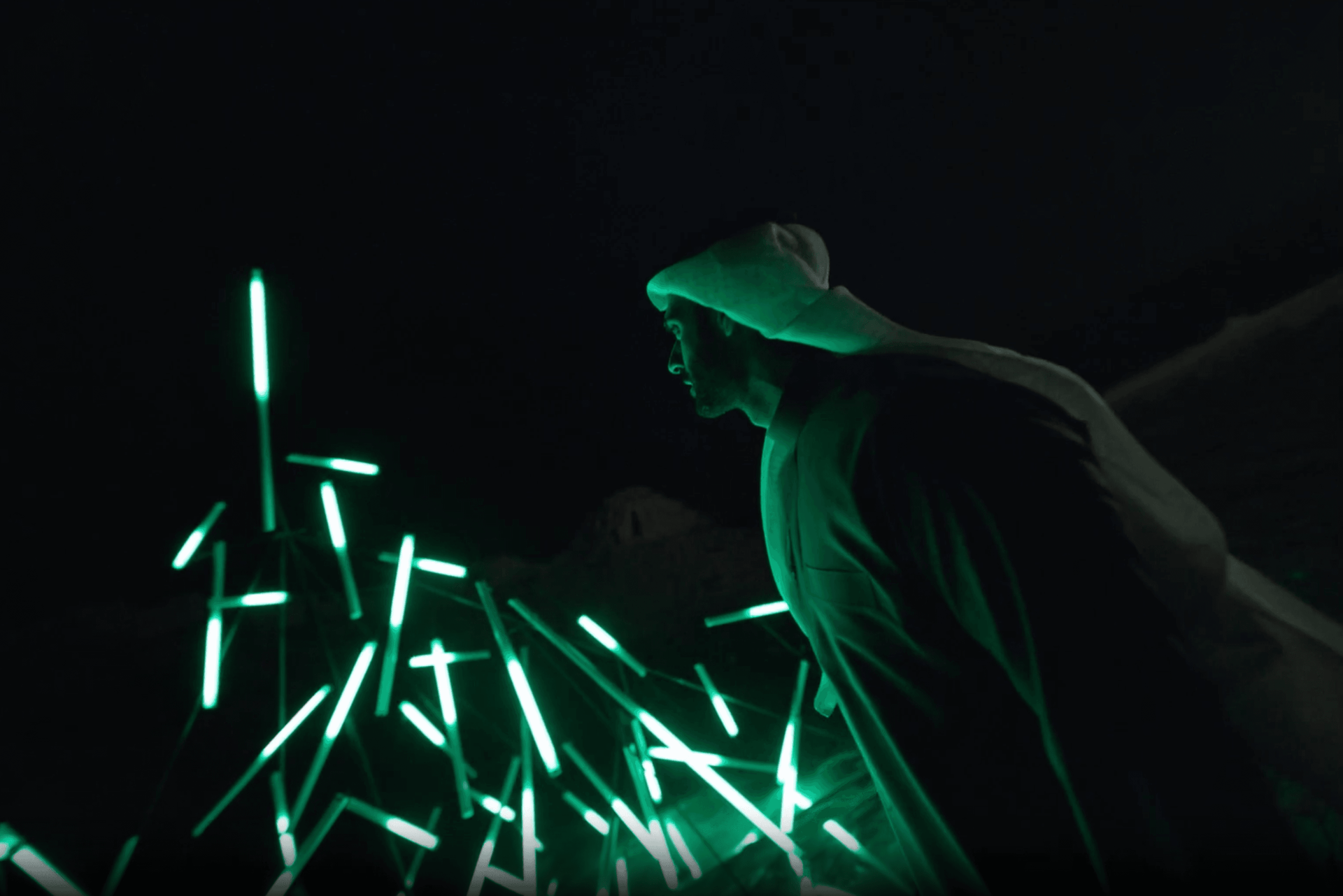 A man symbolizing ROSHN Group’s dynamic growth, surrounded by lights