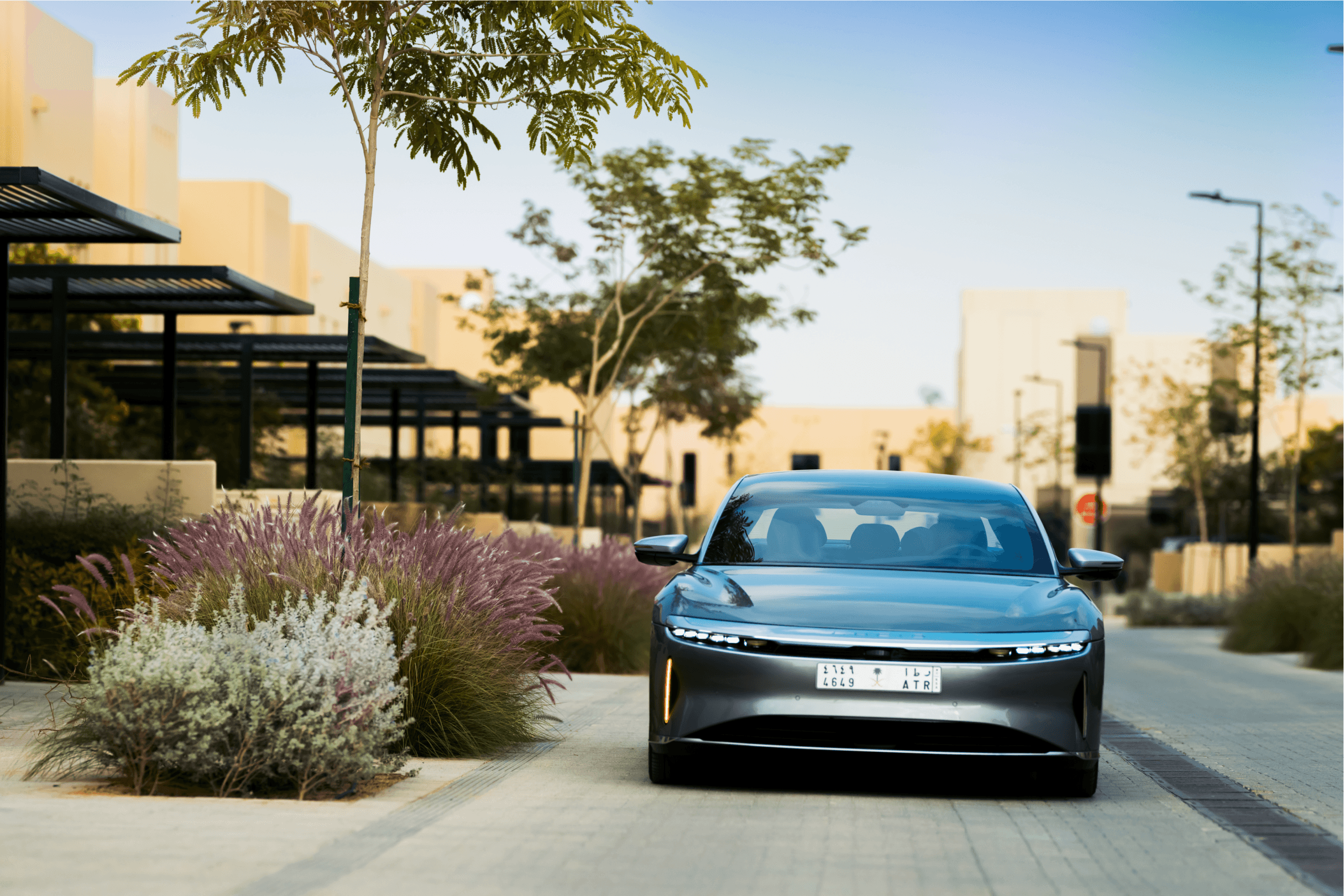 Car parked in a residential area within a ROSHN Group community